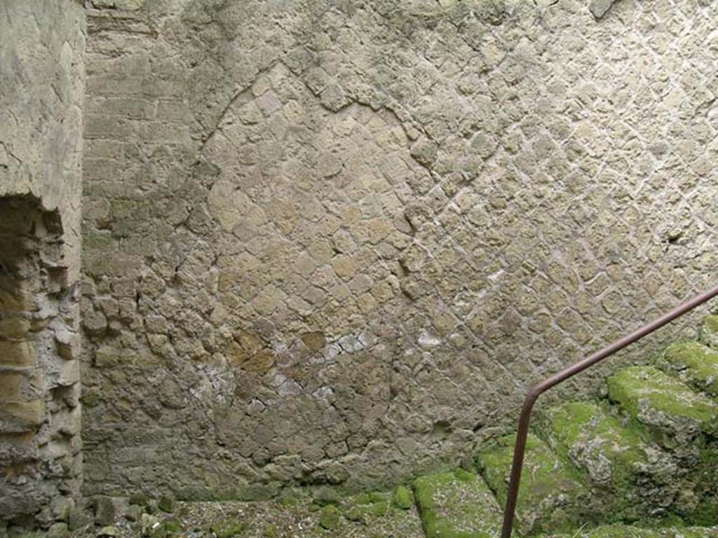 Ins Or II, 15, Herculaneum. May 2004. Rear room, south wall with masonry steps leading up to street level.
The bricked up doorway is on the left. Photo courtesy of Nicolas Monteix.